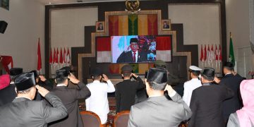 Dipimpin Presiden Jokowi, Bupati Bengkalis Ikuti Upacara Penurunan Bendera Secara Virtual