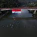 Jembatan Rantau Berangin Kampar Dibentangkan Bendera Merah Putih sepanjang 19x 45 Meter