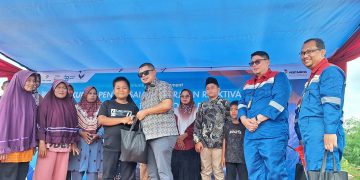 Wujud Syukur, PHR Santuni 50 Dhuafa dan Tuntaskan Solusi Banjir serta Jalan Rusak di South Bekasap Duri